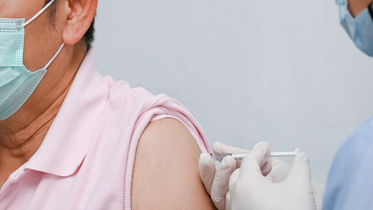 Doctor giving COVID-19 Vaccine shot to the patient for can help stop a pandemic, COVID-19 vaccines can help reduce the transmission of the new coronavirus from person to person. 