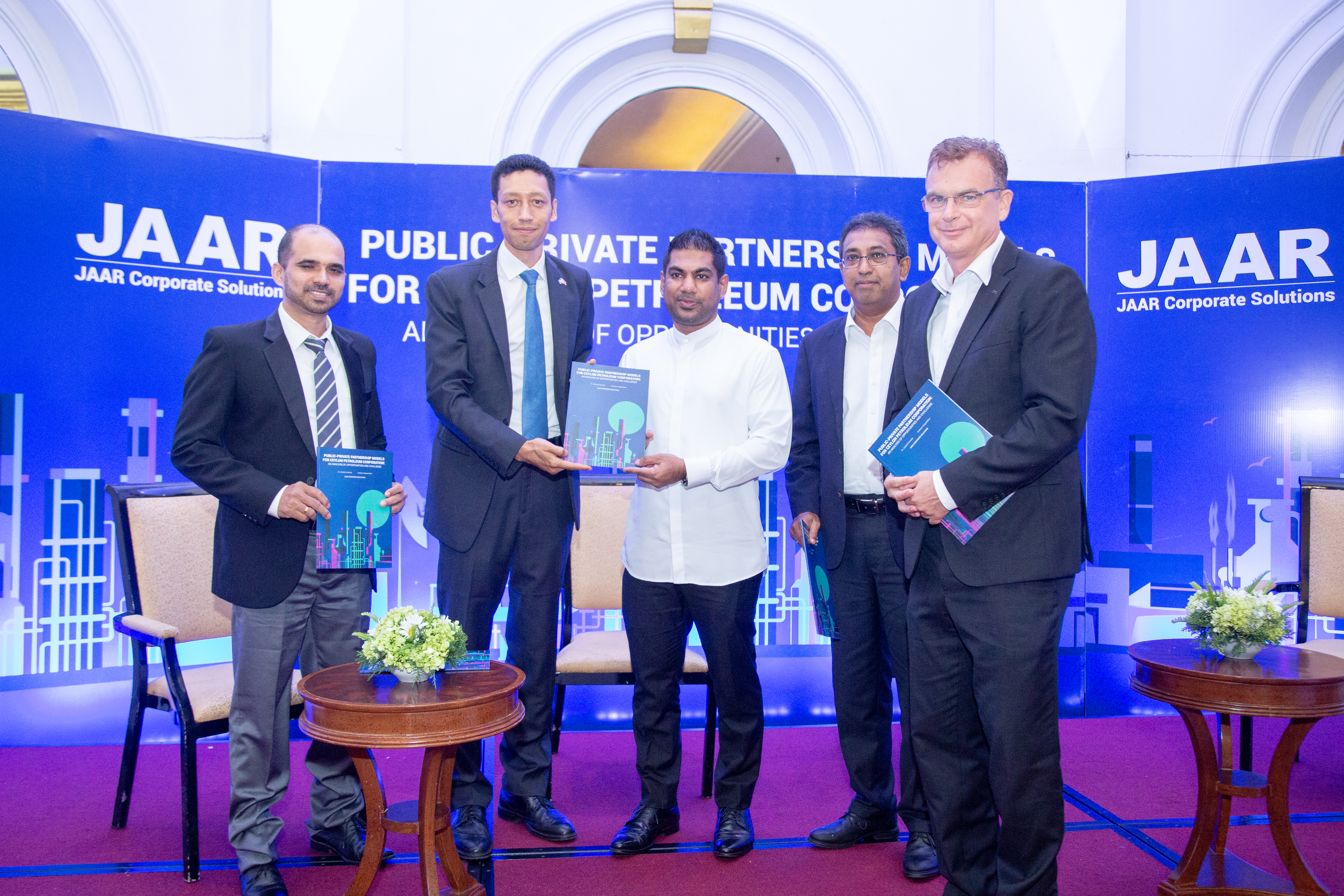 This image represents the handing over of Report launch to the Panelists