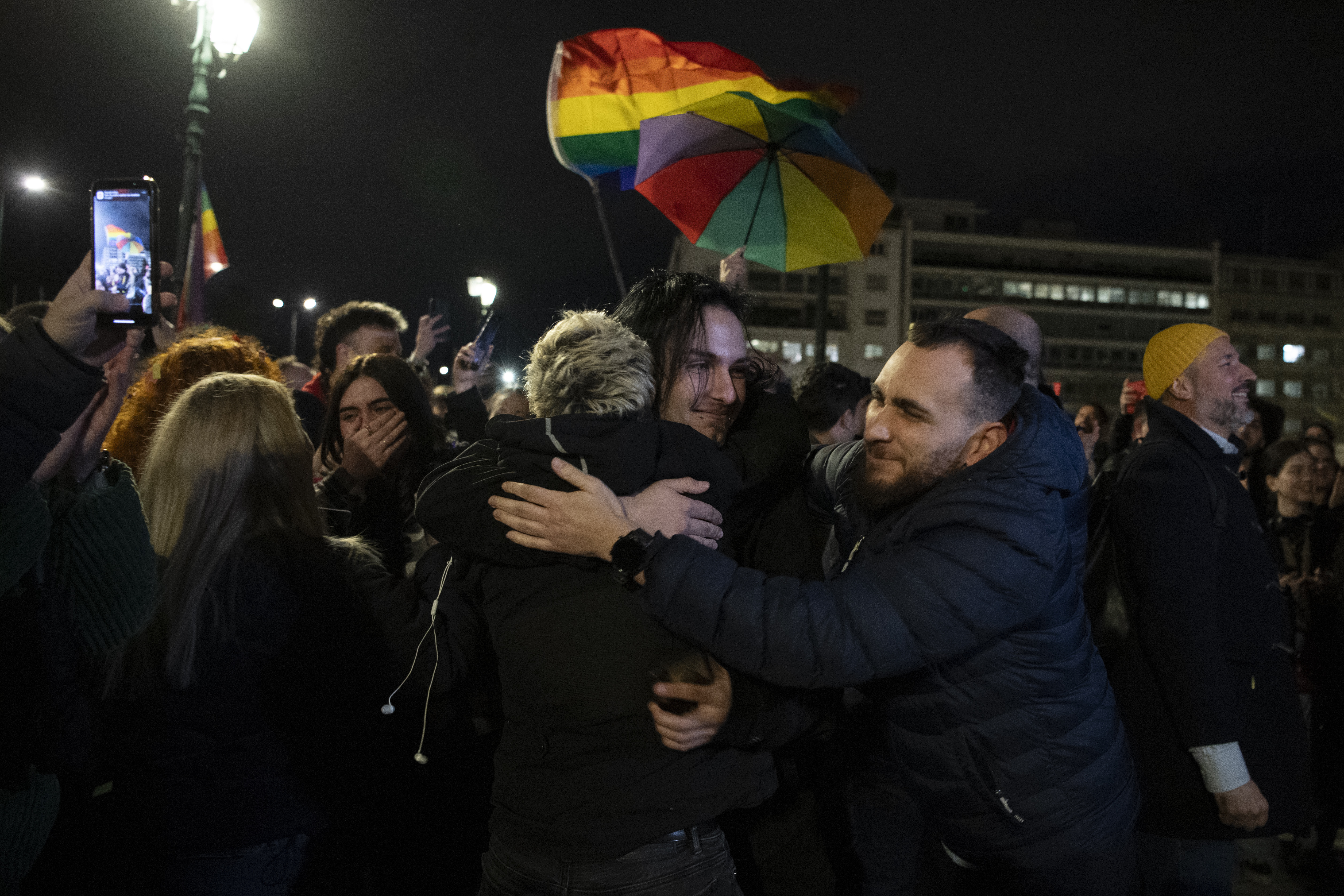 Supporters of the same-sex marriage bill, react during a rally at central Syntagma Square, in Athens, Greece