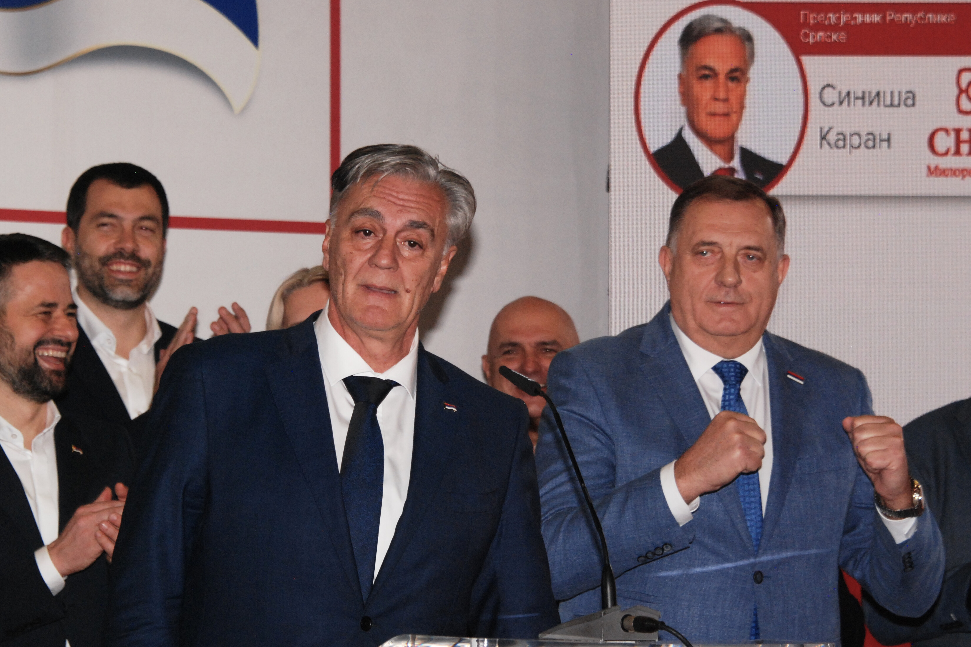 Siniša Karan (front left), supported by former pro-Russian leader Milorad Dodik (right), speaks to the media after his victory in the early presidential elections in Republika Srpska.