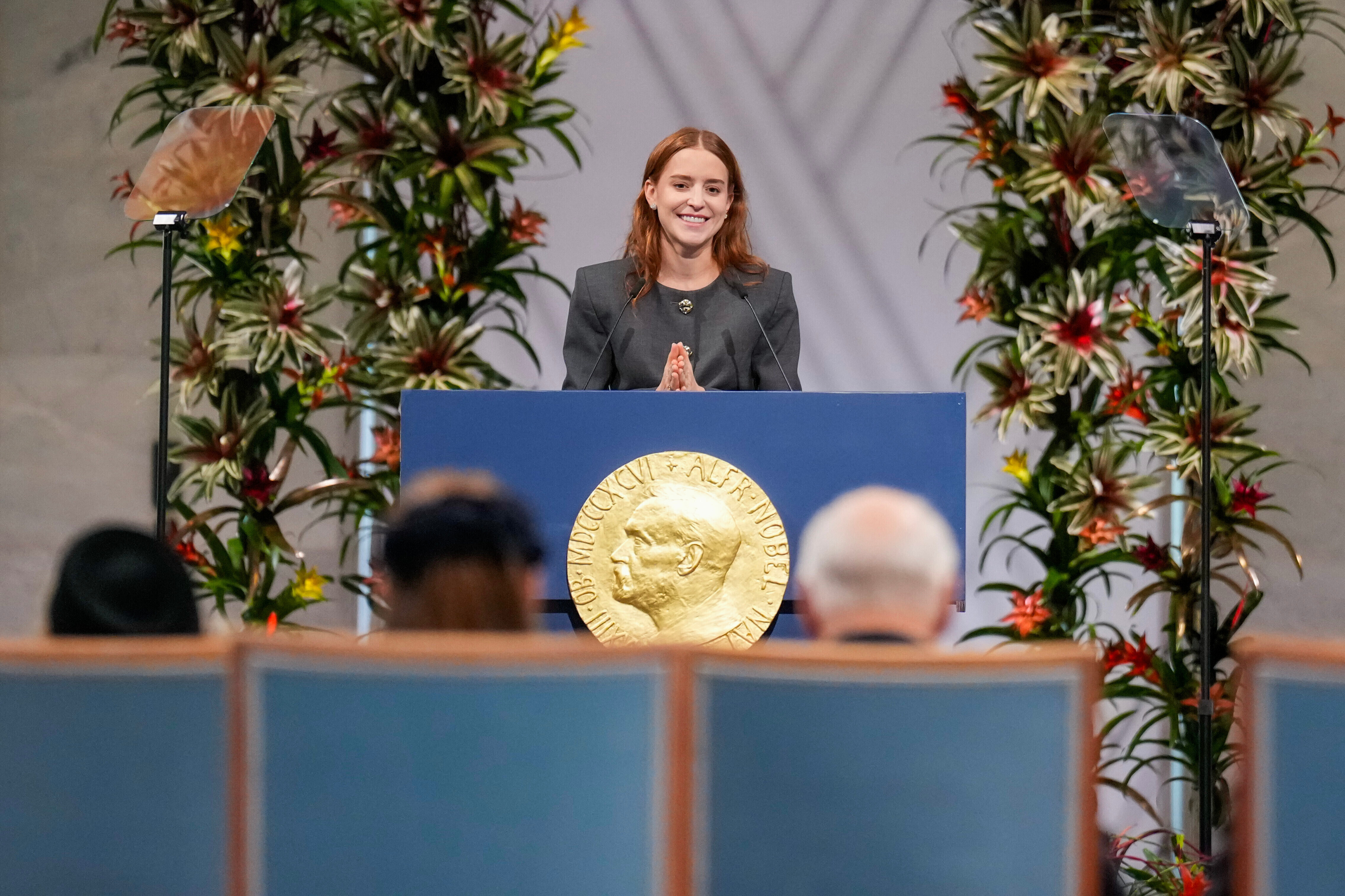 The daughter of the Nobel Peace Prize laureate, Ana Corina Sosa, accepts the award on behalf of her mother, Venezuelan opposition leader Maria Corina Machado, during the Nobel Peace Prize ceremony 