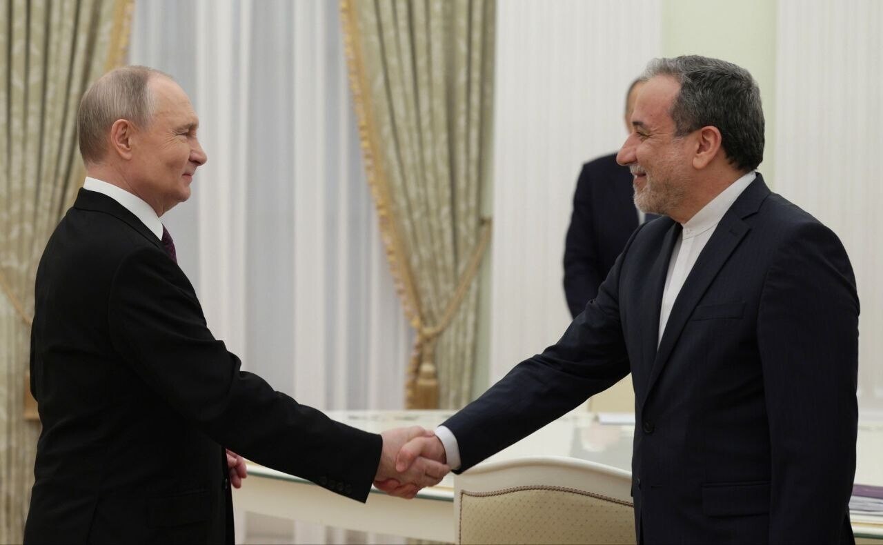 Russian President VLADIMIR PUTIN (L) welcomes Iranian Foreign Minister ABBAS ARAGHCHI 