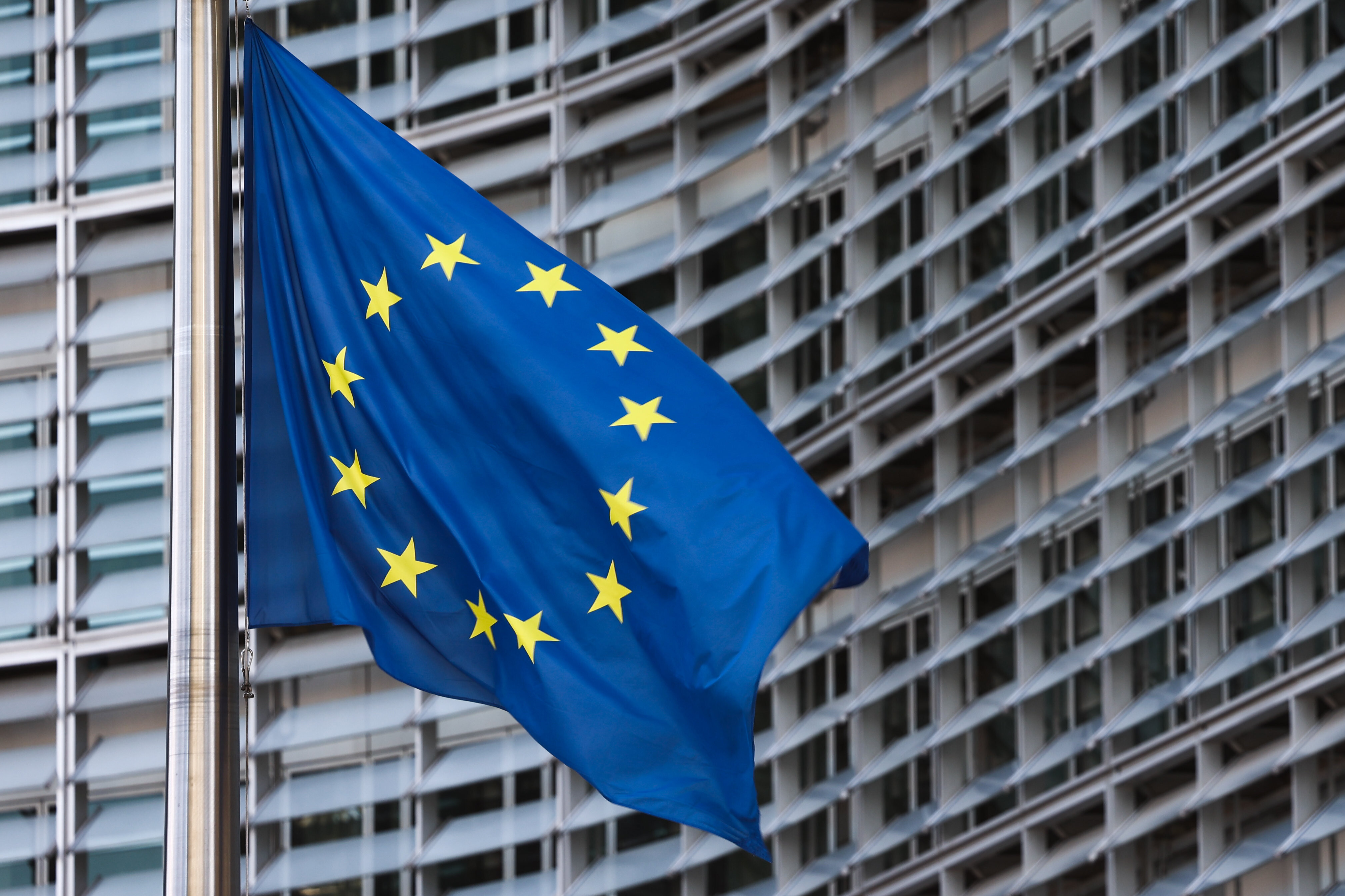 EU flag is seen in front of the European Comission Berlaymont building in Brussels