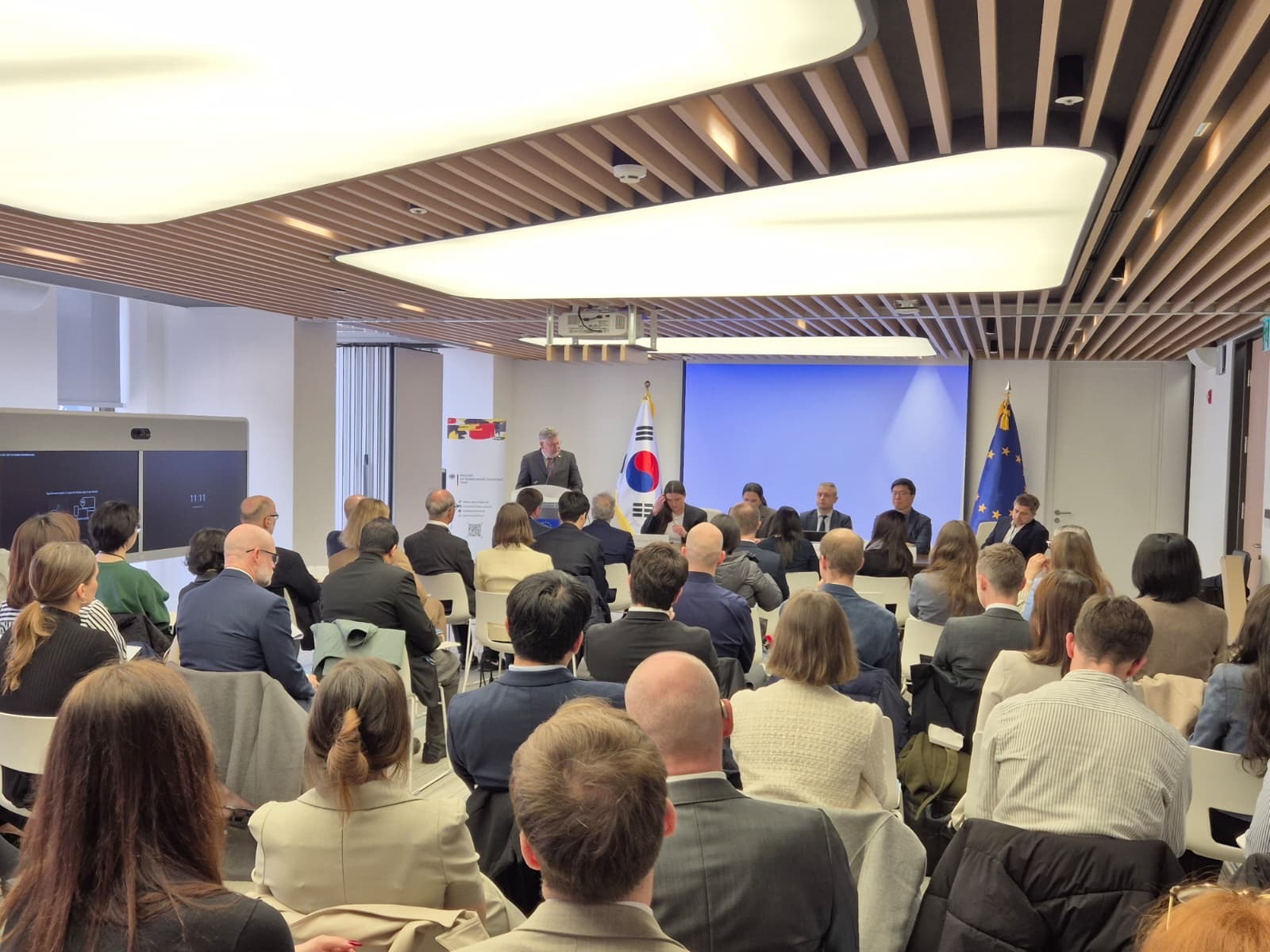 Event at the Delegation of the European Union to the Republic of Korea, showing a panel discussion with many participants.