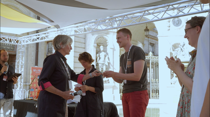 Anne Brasseur handing over the 1st prize to Torben Siebert, Animate Europe 2021 Winner
