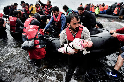 Refugees and migrants arriving on the Greek island of Lesbos