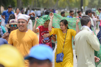 New Delhi/India - 06/11/2019: Tourist cover themselves with a cloth on a hot summer day in New Delhi.
