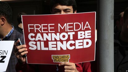 Protests against closing down independent media in Turkey.