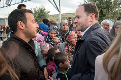 in a refugee camp on Lesbos speaking to Syrians