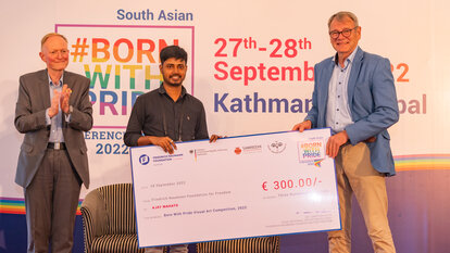 Dr. Carsten Klein, Head - Regional Office, FNF South Asia and Dr. Thomas Prinz, German Ambassador to Nepal with the Art Competition Winner - Mr Ajay Mahato from India.