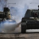 24.02.2022 Armoured vehicles drive along a road in Armyansk in the northern part of Crimea, Russia. 