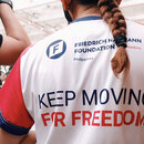 Lady wearing bike shirt with keep moving for freedom text