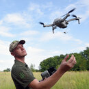  A serviceman looks at a UAV at the base where Ukrainian military personnel learn to control drones for combat missions, Kyiv Region, northern Ukraine. 