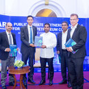 This image represents the handing over of Report launch to the Panelists