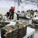 Employees manufacture zero-waste combat dresses 