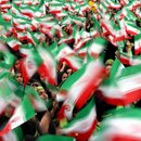 Iranian female students waving national flags during the 30th anniversary of the 1979