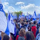 Israelis protesting with flags in front of Supreme Court