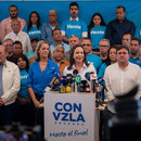 Opposition activist Maria Corina Machado (C) speaks during a press conference in Caracas, Venezuela