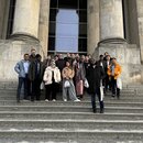 Nurhuda Ramli (author) standing with the other IAF participants on grand staircases in front of a building