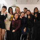 Kasturi (third person standing from the right) with friends she met in Gummersbach. All of them show poses of Korean finger hearts.