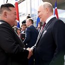 Putin and Kim shaking hands