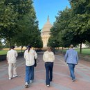 Photo of People Walking Towards the Capitol Building