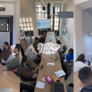 A collage from the first Coffee Talk session by FNF Jordan, showing participants in a lively discussion around a long table in a modern, well-lit space.
