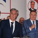 Siniša Karan (front left), supported by former pro-Russian leader Milorad Dodik (right), speaks to the media after his victory in the early presidential elections in Republika Srpska.