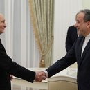 Russian President VLADIMIR PUTIN (L) welcomes Iranian Foreign Minister ABBAS ARAGHCHI 