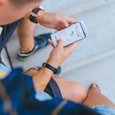 man looking at smartphone