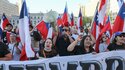 People celebrate in front of La Moneda Palace after the referendum on the proposal for a new constitution was rejected, in Santiago, Chile