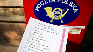 A copy of the 'election package' documents is photographed for illustration photo with Poczta Polska mailbox in the background. Krakow, Poland on May 2nd, 2020. A voting package leaked in the upcoming correspondence election with a full list of candidates for Presidential office and with name and surname statement on secret voting. Despite coronavirus pandemic, Poland's government plans to hold the presidential election on May 10 in the form of a correspondence vote.