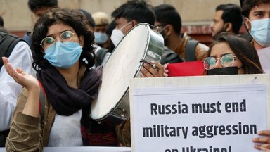 A protester with poster at Anti War protest march in New Delhi's Mandi House against the war in Ukraine
