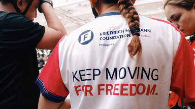 Lady wearing bike shirt with keep moving for freedom text