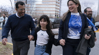 Former Nicaragua presidential candidate Felix Maradiaga reunits with his wife Berta Valle and his daughter Alejandra, walk together after Maradiaga arrived from Nicaragua