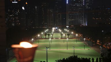 A candle stands near Victoria Park in Hong Kong on Friday, 4 June 2021. People have repeatedly gathered there for a vigil in recent years.