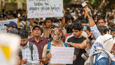 Cockroach Janta Party supporters protest over exam paper leaks in New Delhi.