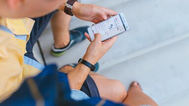 man looking at smartphone