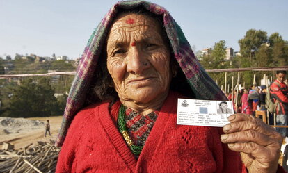 80-year-old Ratna Maya Thapa from the Central Region of Nepal shows her voter registration card after walking for one and a half hours to cast her ballot in the Nepalese Constituent Assembly elections. 10/Apr/2008. Dolakha, Nepal. UN Photo/Nayan Tara. 