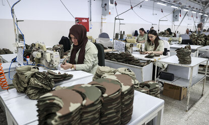 Employees manufacture zero-waste combat dresses 
