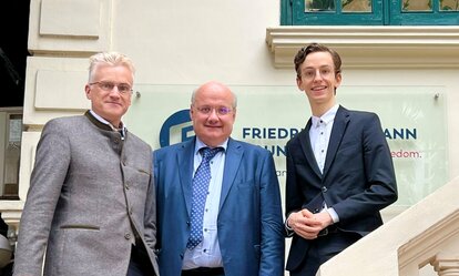 Fritz Kuermayr (right) takes a shot outside FNF Vietnam's office with Austrian Ambassador to Vietnam Hans-Peter Glanzer (middle) and FNF Vietnam Country Director Andreas Stoffers (left)