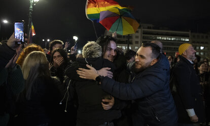 Supporters of the same-sex marriage bill, react during a rally at central Syntagma Square, in Athens, Greece