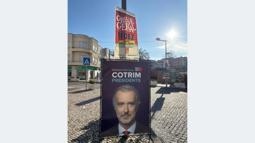 A presidential campaign billboard featuring João Cotrim de Figueiredo in Leiria, Portugal.