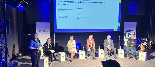 Oleh Baturin in Diskussion beim Cafe Kyiv am 23. Februar 2026