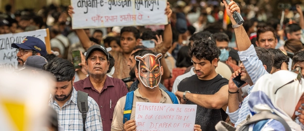 Cockroach Janta Party supporters protest over exam paper leaks in New Delhi.